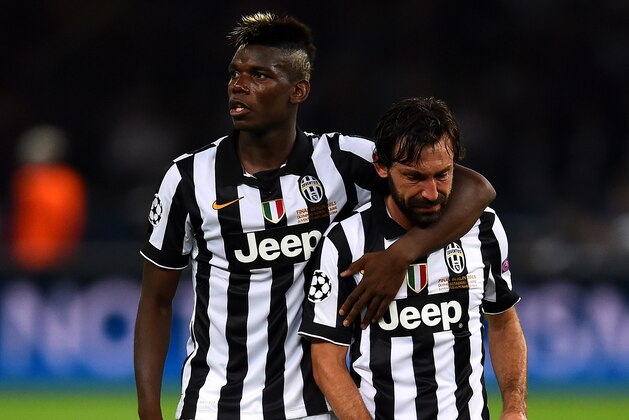 BERLIN, GERMANY - JUNE 06:  Andrea Pirlo of Juventus is consoled by Paul Pogba after the UEFA Champions League Final between Juventus and FC Barcelona at Olympiastadion on June 6, 2015 in Berlin, Germany.  (Photo by Laurence Griffiths/Getty Images)