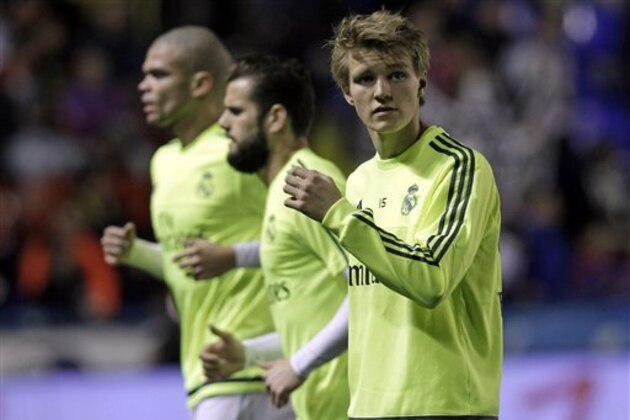 Real Madrid's Martin Odegaard warms up before the Spanish La Liga soccer match between Real Madrid and Levante at the Ciutat de Valencia stadium in Valencia, Spain, Wednesday,  March 2, 2016. (AP Photo/Alberto Saiz)