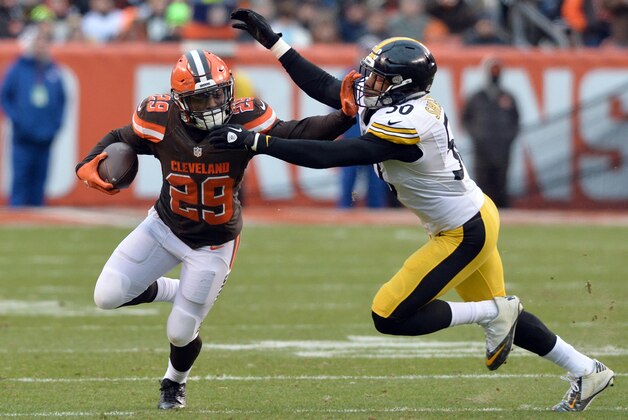 Jan 3, 2016; Cleveland, OH, USA; Cleveland Browns running back Duke Johnson (29) runs by Pittsburgh Steelers inside linebacker Ryan Shazier (50) during the second quarter at FirstEnergy Stadium. Mandatory Credit: Ken Blaze-USA TODAY Sports