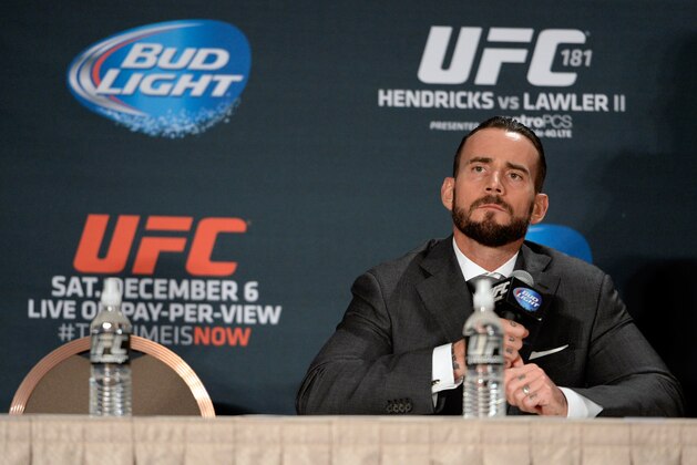 LAS VEGAS, NEVADA - DECEMBER 6:  Phil 'CM Punk' Brooks speaks to the media during the UFC 181 post fight press conference inside the Mandalay Bay Events Center on December 6, 2014 in Las Vegas, Nevada. (Photo by Jeff Bottari/Zuffa LLC/Zuffa LLC via Getty Images)