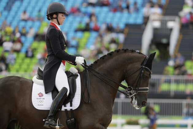 Britain's Charlotte Dujardin, riding Valegro, competes in the equestrian dressage competition at the 2016 Summer Olympics in Rio de Janeiro, Brazil, Friday, Aug. 12, 2016. (AP Photo/John Locher)