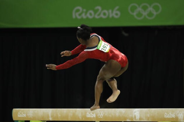 United States' Simone Biles stumbles during her performance on the balance beam during the artistic gymnastics women's apparatus final at the 2016 Summer Olympics in Rio de Janeiro, Brazil, Monday, Aug. 15, 2016. (AP Photo/Dmitri Lovetsky)