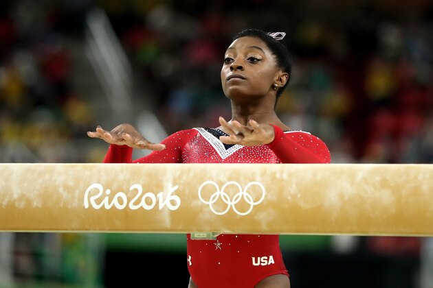 RIO DE JANEIRO, BRAZIL - AUGUST 15:  Simone Biles of the United States prepares to compete in the Balance Beam Final on day 10 of the Rio 2016 Olympic Games at Rio Olympic Arena on August 15, 2016 in Rio de Janeiro, Brazil.  (Photo by Lars Baron/Getty Images)