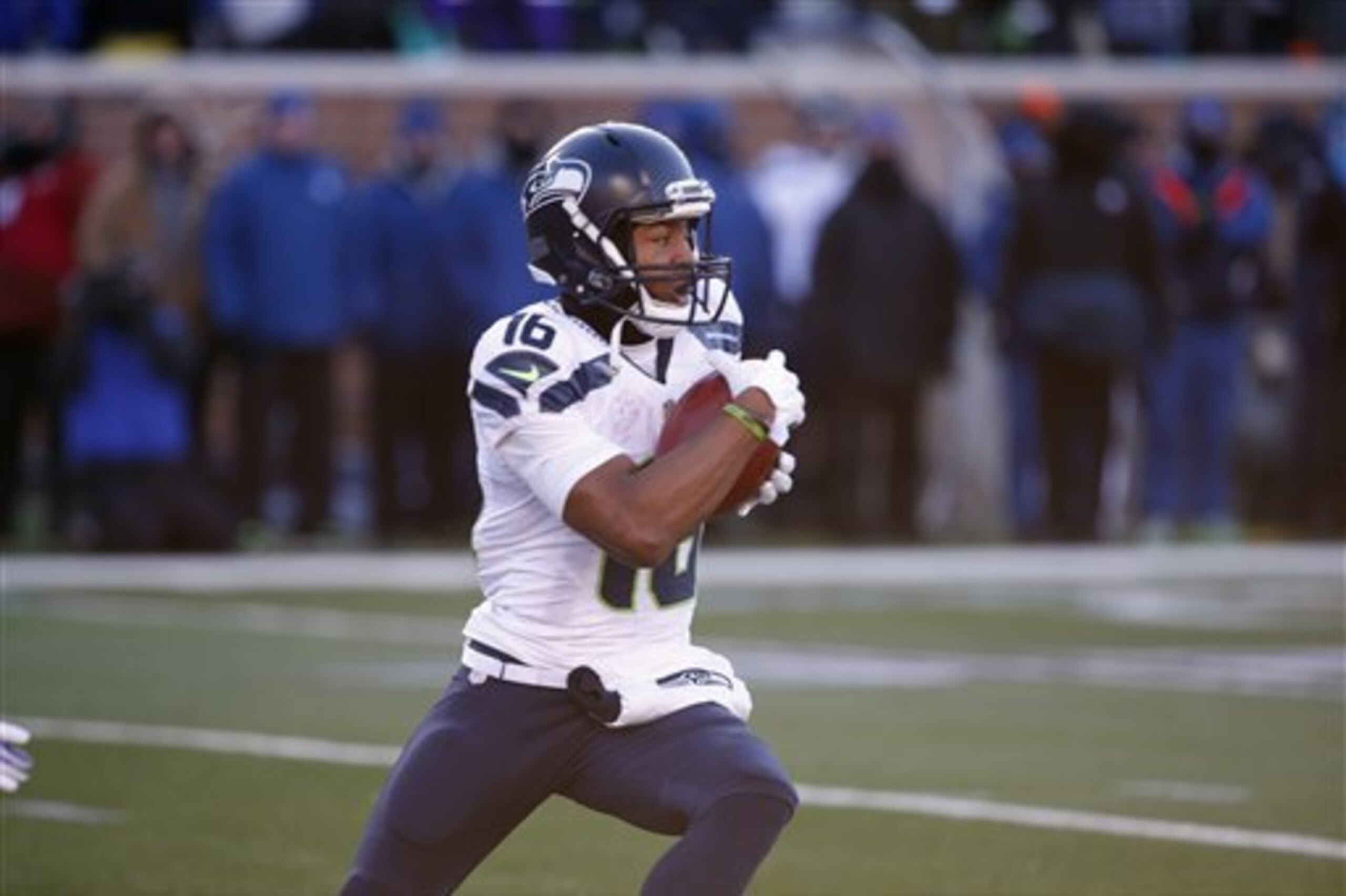 Seattle Seahawks receiver Tyler Lockett (16) runs with the ball during the first half of an NFL wild-card football game against the Minnesota Vikings, Sunday, Jan. 10, 2016, in Minneapolis. (AP Photo/Jim Mone)