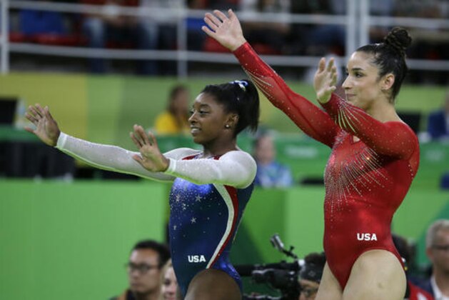 United States' Simone Biles, left, and Aly Raisman wave to the crowd after winning gold and silver respectively for the artistic gymnastics women's individual all-around final at the 2016 Summer Olympics in Rio de Janeiro, Brazil, Thursday, Aug. 11, 2016. (AP Photo/Rebecca Blackwell)