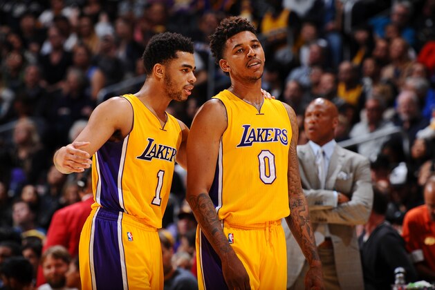 LOS ANGELES, CA - FEBRUARY 19:  D'Angelo Russell #1 of the Los Angeles Lakers and Nick Young #0 of the Los Angeles Lakers talk during the game against the San Antonio Spurs on February 19, 2016 at STAPLES Center in Los Angeles, California. NOTE TO USER: User expressly acknowledges and agrees that, by downloading and/or using this Photograph, user is consenting to the terms and conditions of the Getty Images License Agreement. Mandatory Copyright Notice: Copyright 2016 NBAE (Photo by Juan Ocampo/NBAE via Getty Images)