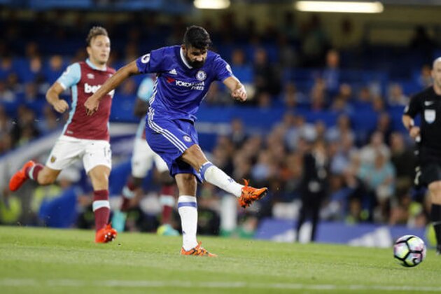 Chelsea's Diego Costa shoots to score during the English Premier League soccer match between Chelsea and West Ham at Stamford Bridge stadium in London, Monday, Aug. 15, 2016.(AP Photo/Frank Augstein)