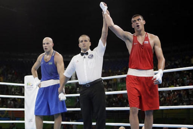 Russia's Evgeny Tishchenko reacts as he win the gold medal for men's heavyweight 91-kg final boxing match against Kazakhstan's Vassiliy Levit during a men's heavyweight 91-kg final boxing match at the 2016 Summer Olympics in Rio de Janeiro, Brazil, Monday, Aug. 15, 2016. (AP Photo/Frank Franklin II)