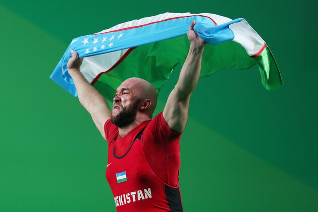 RIO DE JANEIRO, BRAZIL - AUGUST 15:  Ruslan Nurudinov of Uzbekistan celebrates after lifting during the Men's 105kg Group A Weightlifting contest on Day 10 of the Rio 2016 Olympic Games at Riocentro - Pavilion 2 on August 15, 2016 in Rio de Janeiro, Brazil.  (Photo by Tom Pennington/Getty Images)