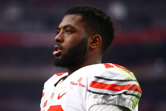 Jan 1, 2016; Glendale, AZ, USA; Ohio State Buckeyes quarterback J.T. Barrett (16) against the Notre Dame Fighting Irish during the 2016 Fiesta Bowl at University of Phoenix Stadium. The Buckeyes defeated the Fighting Irish 44-28. Mandatory Credit: Mark J. Rebilas-USA TODAY Sports