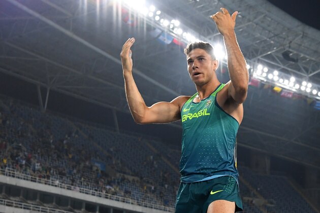Brazil's Thiago Braz Da Silva reacts after clearing the bar in the Men's Pole Vault Final during the athletics competition at the Rio 2016 Olympic Games at the Olympic Stadium in Rio de Janeiro on August 15, 2016. / AFP / FRANCK FIFE        (Photo credit should read FRANCK FIFE/AFP/Getty Images)