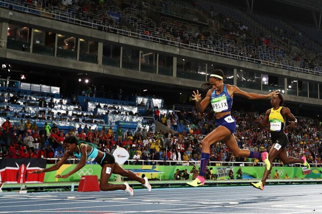 RIO DE JANEIRO, BRAZIL - AUGUST 15:  Shaunae Miller of the Bahamas (L) dives over the finish line to win the gold medal in the Women's 400m Final ahead of silver medalist Allyson Felix of the United States (C) and bronze medalist Shericka Jackson of Jamaica (R) on Day 10 of the Rio 2016 Olympic Games at the Olympic Stadium on August 15, 2016 in Rio de Janeiro, Brazil.  (Photo by Alexander Hassenstein/Getty Images)