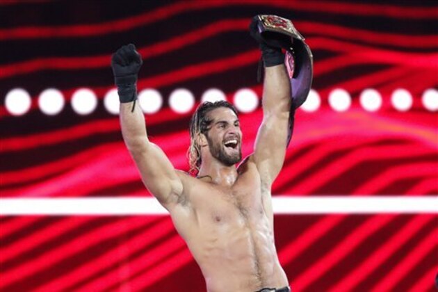 WWE Superstar Seth Rollins celebrates becoming the new WWE World Heavyweight Champion at WrestleMania 31 at Levi's Stadium on Sunday, March 29, 2015 in Santa Clara, CA. WrestleMania broke the Levi’s Stadium attendance record at 76,976 fans from all 50 states and 40 countries. (Don Feria/AP Images for WWE)