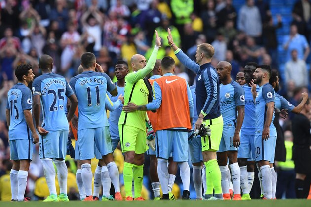 Manchester City's English goalkeeper Joe Hart (CR) high-fives Manchester CIty's Argentinian goalkeeper Willy Caballero (CL) after the final whistle of the English Premier League football match between Manchester City and Sunderland at the Etihad Stadium in Manchester, north west England, on August 13, 2016. / AFP / PAUL ELLIS / RESTRICTED TO EDITORIAL USE. No use with unauthorized audio, video, data, fixture lists, club/league logos or 'live' services. Online in-match use limited to 75 images, no video emulation. No use in betting, games or single club/league/player publications.  /         (Photo credit should read PAUL ELLIS/AFP/Getty Images)
