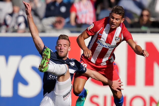 GEELONG, AUSTRALIA - JULY 31:  Nick Ansell of the Victory and Rafael Santos Borre of Atletico Madrid compete for the ball during the match between Melbourne Victory and Atletico de Madrid at Simonds Stadium on July 31, 2016 in Geelong, Australia.  (Photo by Darrian Traynor/Getty Images)