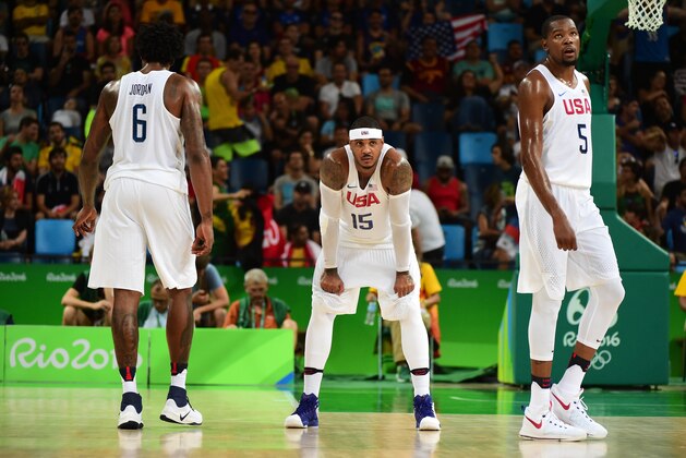 RIO DE JANEIRO, BRAZIL - AUGUST 14:  Carmelo Anthony #15 of United States and teammates DeAndre Jordan #6 and Kevin Durant #5 look on during a Men's Preliminary Round Group A game between the United States and France on Day 9 of the Rio 2016 Olympic Games at Carioca Arena 1 on August 14, 2016 in Rio de Janeiro, Brazil.  (Photo by Harry How/Getty Images)