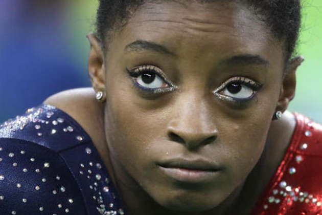 United States' Simone Biles waits to perform her floor routine during the artistic gymnastics women's qualification at the 2016 Summer Olympics in Rio de Janeiro, Brazil, Sunday, Aug. 7, 2016. (AP Photo/Julio Cortez)