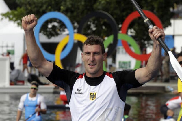 Germany's Sebastian Brendel celebrates his gold medal in the men's canoe single 1000m final during the 2016 Summer Olympics in Rio de Janeiro, Brazil, Tuesday, Aug. 16, 2016. (AP Photo/Luca Bruno)