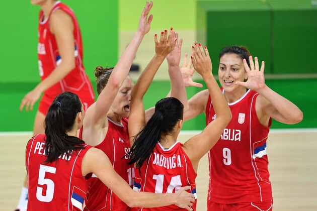 (From L) Serbia's forward Sonja Petrovic, Serbia's power forward Danielle Page, Serbia's shooting guard Ana Dabovic and Serbia's power forward Jelena Milovanovic celebrate a point during a Women's quarterfinal basketball match between Australia and Serbia at the Carioca Arena 1 in Rio de Janeiro on August 16, 2016 during the Rio 2016 Olympic Games.  / AFP / Andrej ISAKOVIC        (Photo credit should read ANDREJ ISAKOVIC/AFP/Getty Images)