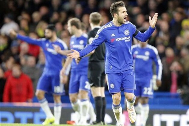 Chelsea's Cesc Fabregas shouts at supporters after his team scored during the English Premier League soccer match between Chelsea and Norwich City at Stamford Bridge stadium in London, Saturday, Nov. 21, 2015 .(AP Photo/Frank Augstein)