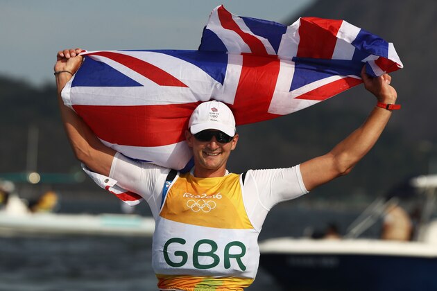 RIO DE JANEIRO, BRAZIL - AUGUST 16:  Giles Scott of Great Britain celebrates winning the gold medal in the Finn class on Day 11 of the Rio 2016 Olympic Games at the Marina da Gloria on August 16, 2016 in Rio de Janeiro, Brazil.  (Photo by Clive Mason/Getty Images)