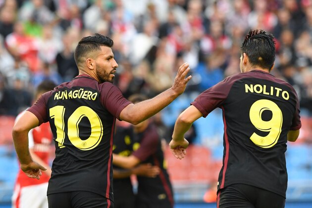 Manchester City's Argentinian forward Sergio Aguero (L) celebrates with his teammate Spanish forward Nolito after scoring during the friendly football match between Arsenal and Manchester City at the Ullevi stadium in Gothenburg on August 7, 2016. / AFP / JONATHAN NACKSTRAND        (Photo credit should read JONATHAN NACKSTRAND/AFP/Getty Images)