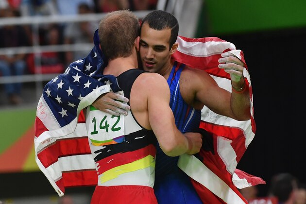 Germany's Fabian Hambuechen (L) celebrates with US gymnast Danell Leyva after the men's Horizontal bar event final of the Artistic Gymnastics at the Olympic Arena during the Rio 2016 Olympic Games in Rio de Janeiro on August 16, 2016. / AFP / Ben STANSALL        (Photo credit should read BEN STANSALL/AFP/Getty Images)