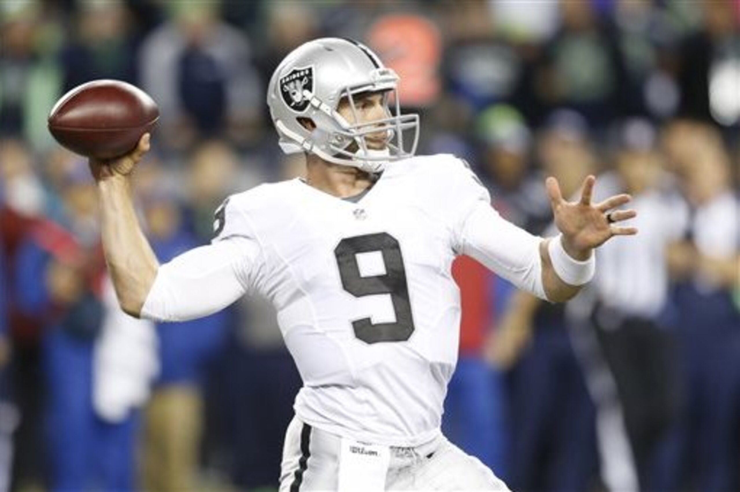 FILE - In this Sept. 3, 2015, file photo, Oakland Raiders quarterback Christian Ponder passes the ball in the second half of a preseason NFL football game against the Seattle Seahawks, in Seattle. With Peyton Manning out until at least mid-December, the Denver Broncos have bolstered their depth at quarterback by signing Christian Ponder. The former Minnesota Vikings first-rounder will serve as the Broncos' third QB behind starter Brock Osweiler and Trevor Siemian.(AP Photo/Stephen Brashear, File)