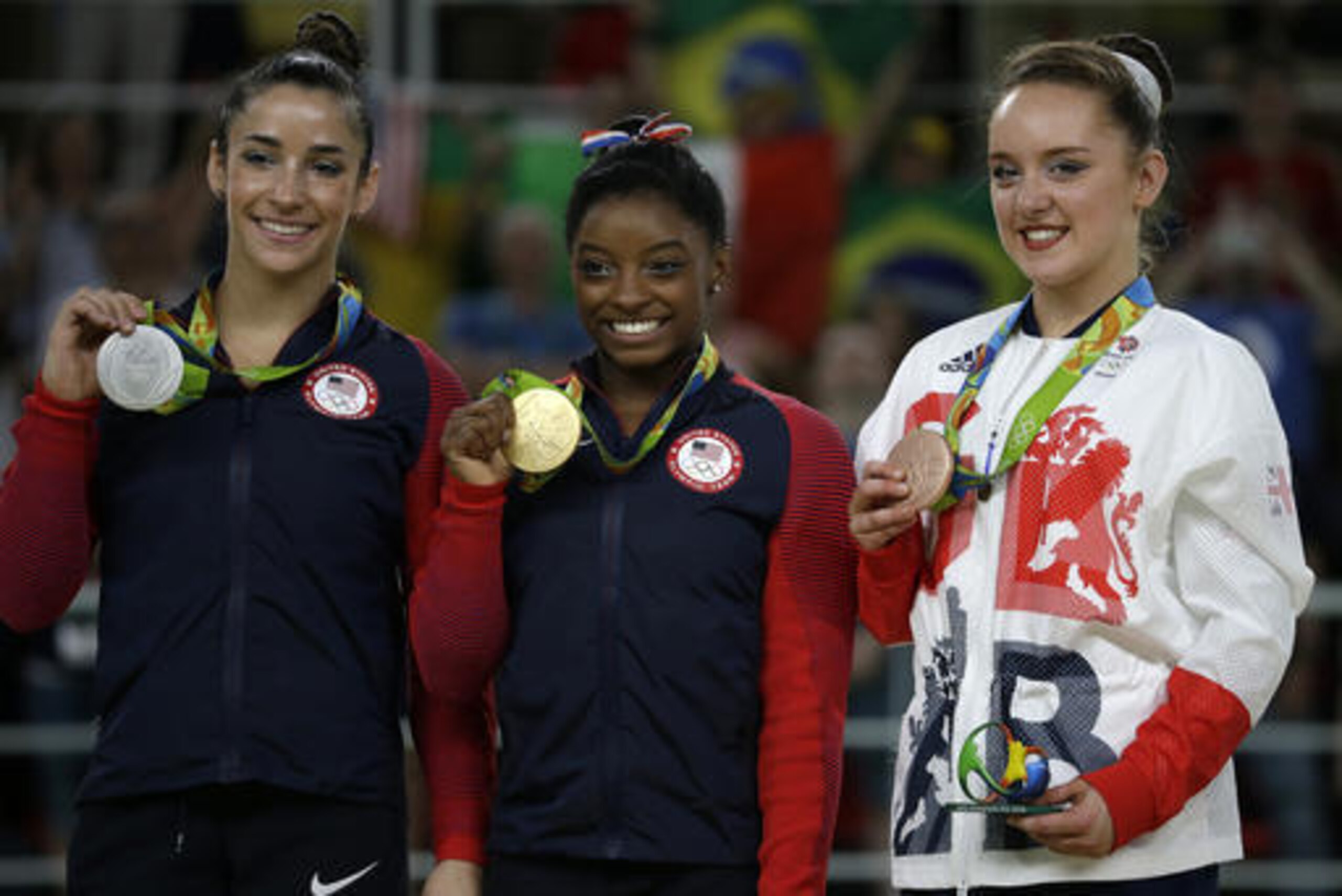 From left, United States' Aly Raisman, silver for floor, compatriot Simone Biles, gold, and Britain's Amy Tinkler, silver, display their medals during the artistic gymnastics women's apparatus final at the 2016 Summer Olympics in Rio de Janeiro, Brazil, Tuesday, Aug. 16, 2016. (AP Photo/Rebecca Blackwell)