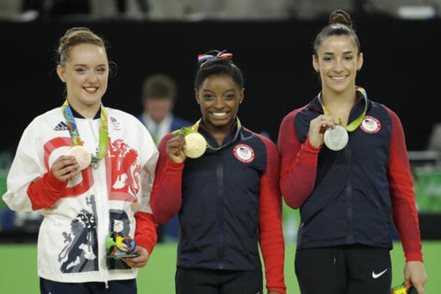 From right, United States' Aly Raisman, silver for floor, compatriot Simone Biles, gold, and Britain's Amy Tinkler, silver, display their medals during the artistic gymnastics women's apparatus final at the 2016 Summer Olympics in Rio de Janeiro, Brazil, Tuesday, Aug. 16, 2016. (AP Photo/Dmitri Lovetsky)