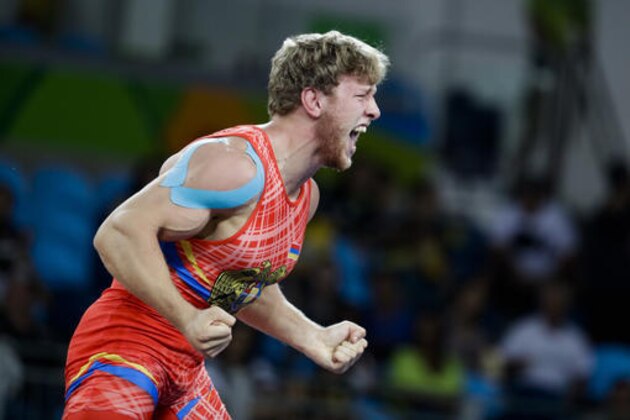 Armenia's Artur Aleksanyan reacts after defeating Turkey's Cenk Ildem during the men's wrestling Greco-Roman -kg competition at the 2016 Summer Olympics in Rio de Janeiro, Brazil, Tuesday, Aug. 16, 2016. (AP Photo/Markus Schreiber)