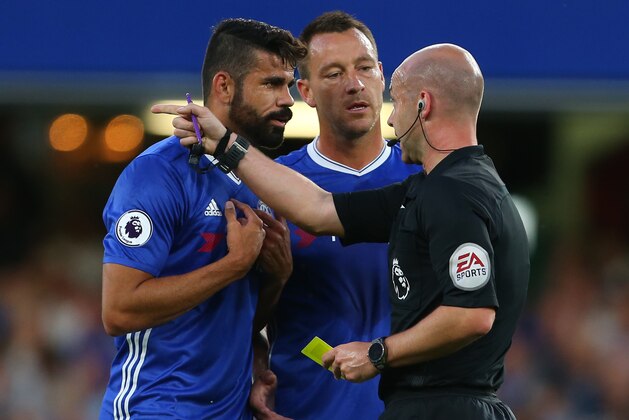 LONDON, ENGLAND - AUGUST 15: Diego Costa and John Terry of Chelsea speak with referee Anthony Taylor
 during the Premier League match between Chelsea and West Ham United at Stamford Bridge on August 15, 2016 in London, England. (Photo by Catherine Ivill - AMA/Getty Images)