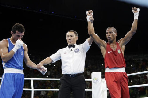 Brazil's Robson Conceicao, right, reacts as he won the gold medal for the men's lightweight 60-kg final boxing match against France's Sofiane Oumiha at the 2016 Summer Olympics in Rio de Janeiro, Brazil, Tuesday, Aug. 16, 2016. (AP Photo/Jae C. Hong)