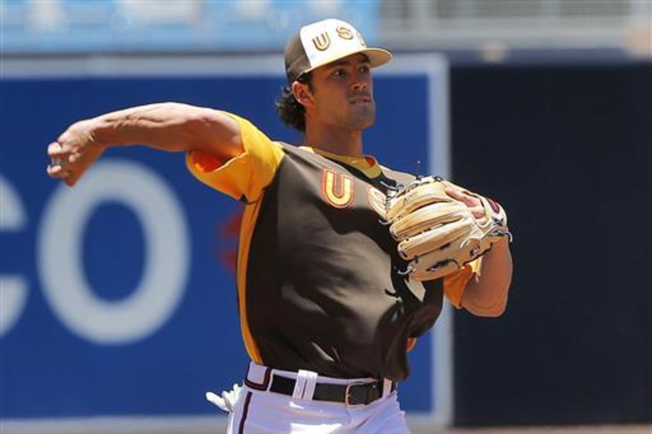 U.S team's Dansby Swanson, of the Atlanta Braves, warms up prior to the All-Star Futures baseball game against the World team, Sunday, July 10, 2016, in San Diego. (AP Photo/Lenny Ignelzi)