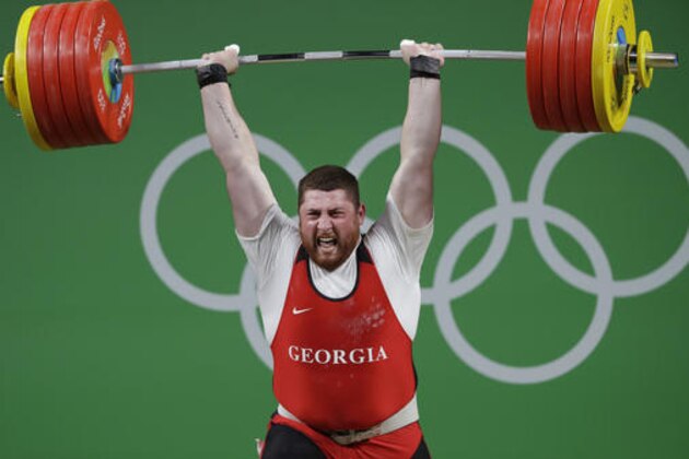 Lasha Talakhadze, of Georgia, competes in the men's +105 kg weightlifting event at the 2016 Summer Olympics in Rio de Janeiro, Brazil, Tuesday, Aug. 16, 2016. Talakhadze won the gold medal. (AP Photo/Mike Groll)