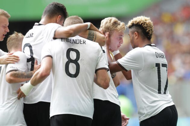 Germany's Serge Gnabry, right, is congratulated after scoring his side's first goal during a quarter-final match of the men's Olympic football tournament between Germany and Portugal at the National Stadium, in Brasilia, Brazil, Saturday, Aug. 13, 2016. (AP Photo/Eraldo Peres)