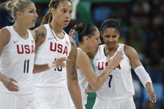 United States' Diana Taurasi, second from right, pats teammate Maya Moore as they walk off the court during a women's quarterfinal round basketball game against Japan at the 2016 Summer Olympics in Rio de Janeiro, Brazil, Tuesday, Aug. 16, 2016. (AP Photo/Eric Gay)