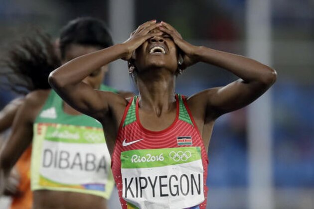 Kenya's Faith Chepngetich Kipyegon crosses the line to win the gold medal in the women's 1500-meter final during the athletics competitions of the 2016 Summer Olympics at the Olympic stadium in Rio de Janeiro, Brazil, Tuesday, Aug. 16, 2016. (AP Photo/David J. Phillip)