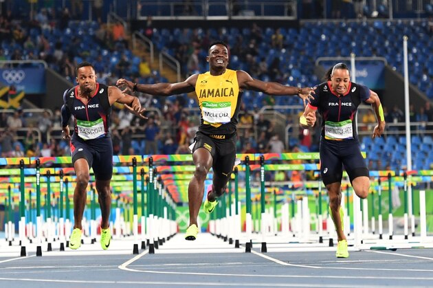Jamaica's Omar McLeod (C) reacts as he crosses the finish line ahead of third placed France's Dimitri Bascou (L) and fourth placed France's Pascal Martinot-Lagarde to win the Men's 110m Hurdles Final during the athletics event at the Rio 2016 Olympic Games at the Olympic Stadium in Rio de Janeiro on August 16, 2016.   / AFP / OLIVIER MORIN        (Photo credit should read OLIVIER MORIN/AFP/Getty Images)