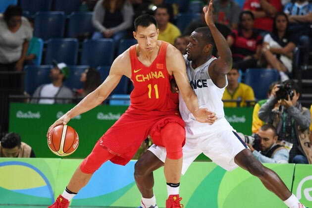 China's forward Yi Jianlian (L) holds off China's small forward Ding Yanyuhang during a Men's round Group A basketball match between France and China at the Carioca Arena 1 in Rio de Janeiro on August 8, 2016 during the Rio 2016 Olympic Games. / AFP / Mark RALSTON        (Photo credit should read MARK RALSTON/AFP/Getty Images)