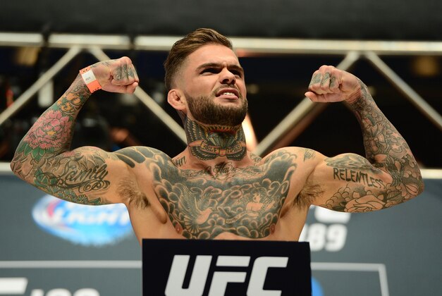 Jul 10, 2015; Las Vegas, NV, USA; Cody Garbrandt weighs in against Henry Briones (not pictured) during weigh-ins for UFC 189 at MGM Grand Garden Arena. Mandatory Credit: Joe Camporeale-USA TODAY Sports