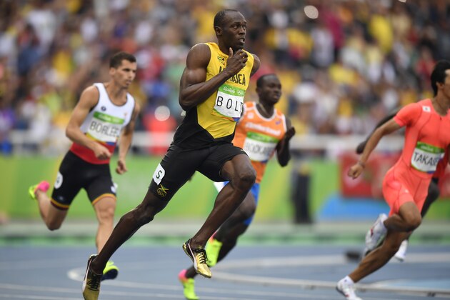 Jamaica's Usain Bolt competes in the Men's 200m Round 1 during the athletics event at the Rio 2016 Olympic Games at the Olympic Stadium in Rio de Janeiro on August 16, 2016.   / AFP / Fabrice COFFRINI        (Photo credit should read FABRICE COFFRINI/AFP/Getty Images)