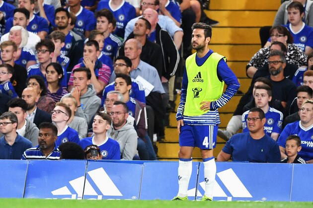 LONDON, ENGLAND - AUGUST 15: Cesc Fabregas of Chelsea looks on from the sidelines during the Premier League match between Chelsea and West Ham United at Stamford Bridge on August 15, 2016 in London, England.  (Photo by Michael Regan/Getty Images)