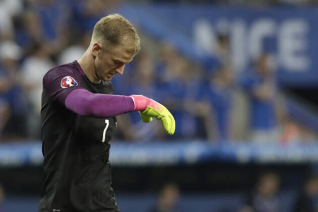 FILE - In this Monday, June 27, 2016 file photo, England goalkeeper Joe Hart walks on the pitch during the Euro 2016 round of 16 soccer match between England and Iceland, at the Allianz Riviera stadium in Nice, France. Manchester City manager Pep Guardiola has cast doubt on whether goalkeeper Joe Hart remains part of the club’s long-term plans. Asked how central Hart was to City on Friday, Aug. 12, Guardiola said he is happy with the England international’s “behavior and what he means to this club” before adding “after, we are going to decide inside the doors. (AP Photo/Pavel Golovkin, file)