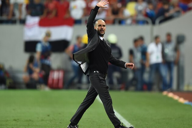 Coach Josep Guardiola of Manchester City celebrates victory after the UEFA Champions league first leg play-off football match between Steaua Bucharest and Manchester City at the National Arena stadium in Bucharest on August 16, 2016.  / AFP / DANIEL MIHAILESCU        (Photo credit should read DANIEL MIHAILESCU/AFP/Getty Images)