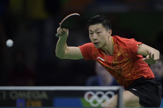 China's Ma Long returns the ball to Britain's Liam Pitchford during the men's team quarter-final table tennis match at the Riocentro venue during the Rio 2016 Olympic Games in Rio de Janeiro on August 14, 2016. / AFP / Juan Mabromata        (Photo credit should read JUAN MABROMATA/AFP/Getty Images)