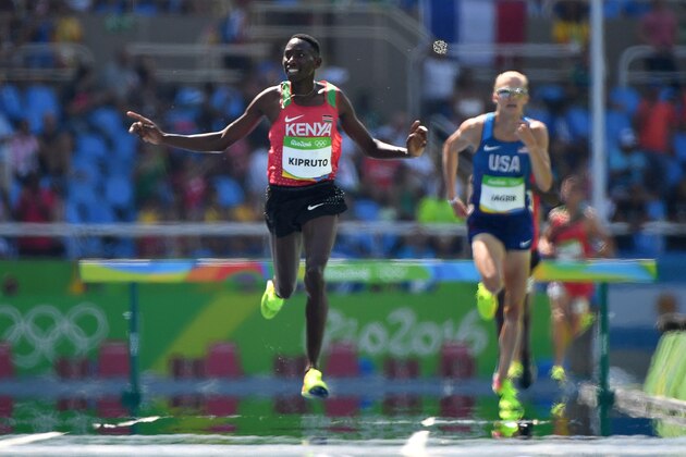 Kenya's Conseslus Kipruto celebrates after he won the Men's 3000m Steeplechase Final during the athletics event at the Rio 2016 Olympic Games at the Olympic Stadium in Rio de Janeiro on August 17, 2016.   / AFP / OLIVIER MORIN        (Photo credit should read OLIVIER MORIN/AFP/Getty Images)