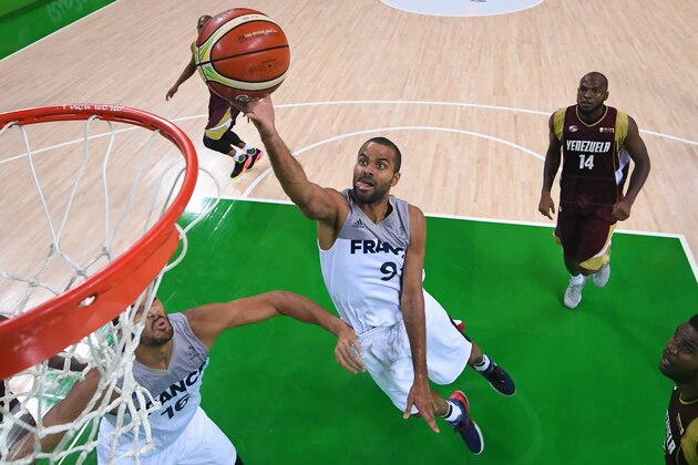 Aug 12, 2016; Rio de Janeiro, Brazil; France guard Tony Parker (9) goes up for a shot ahead of Venezuela forward Miguel Ruiz (14) during the game in the preliminary round of the Rio 2016 Summer Olympic Games at Carioca Arena 1. Mandatory Credit: Jason Getz-USA TODAY Sports