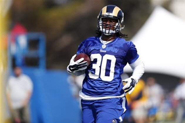 Los Angeles Rams running back Todd Gurley carries the football during the NFL football team's training camp, Saturday, July 30, 2016, in Irvine, Calif. (AP Photo/Ryan Kang)