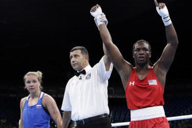 United States' Claresa Maria Shields, right, reacts as she won a women's middleweight 75-kg quarterfinals boxing match against Russia's Iaroslava Iakushina at the 2016 Summer Olympics in Rio de Janeiro, Brazil, Wednesday, Aug. 17, 2016. (AP Photo/Frank Franklin II)